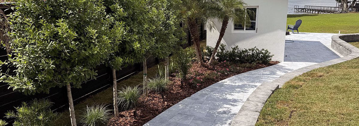 Lakeside Spa Retreat: Central Florida Landscaping with Elevated Design by BLG Environmental Services