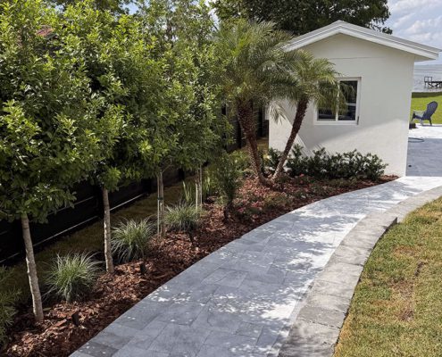 Lakeside Spa Retreat: Central Florida Landscaping with Elevated Design by BLG Environmental Services