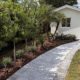 Lakeside Spa Retreat: Central Florida Landscaping with Elevated Design by BLG Environmental Services