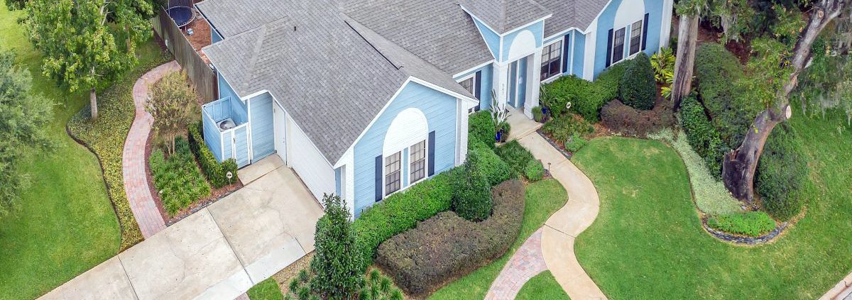 Sustainable landscape design in Orlando with climate-adapted plants, drainage planning, and outdoor living elements.